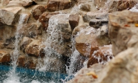 Stone Walls and a Stone Patio Make a Boulder Landscape