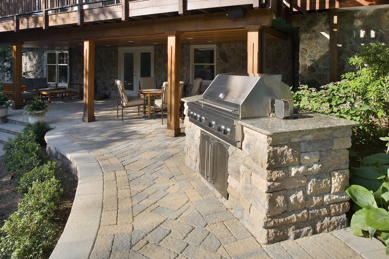outdoor grill and stone patio